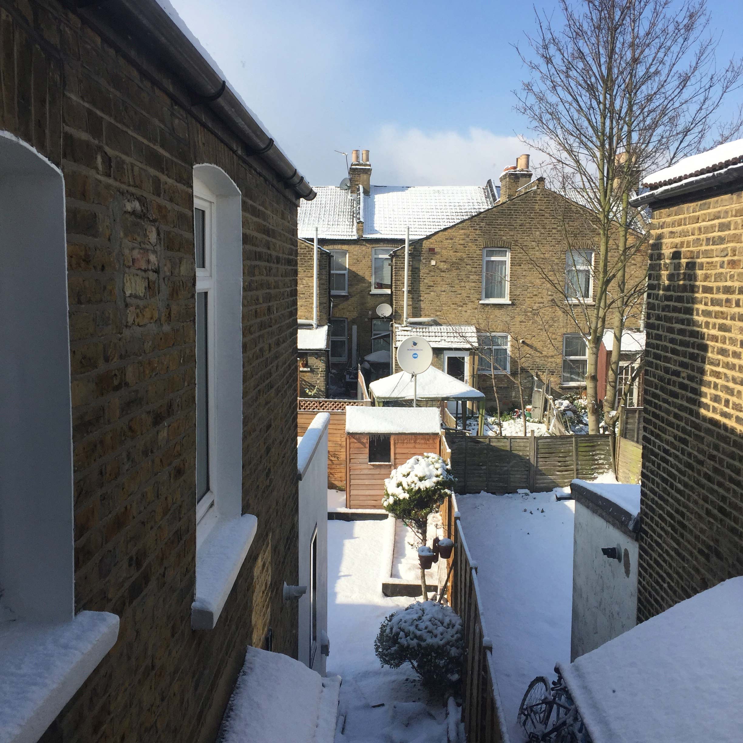 Snow on terraced houses in east London