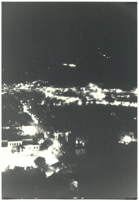 Black and white photo of city at night
