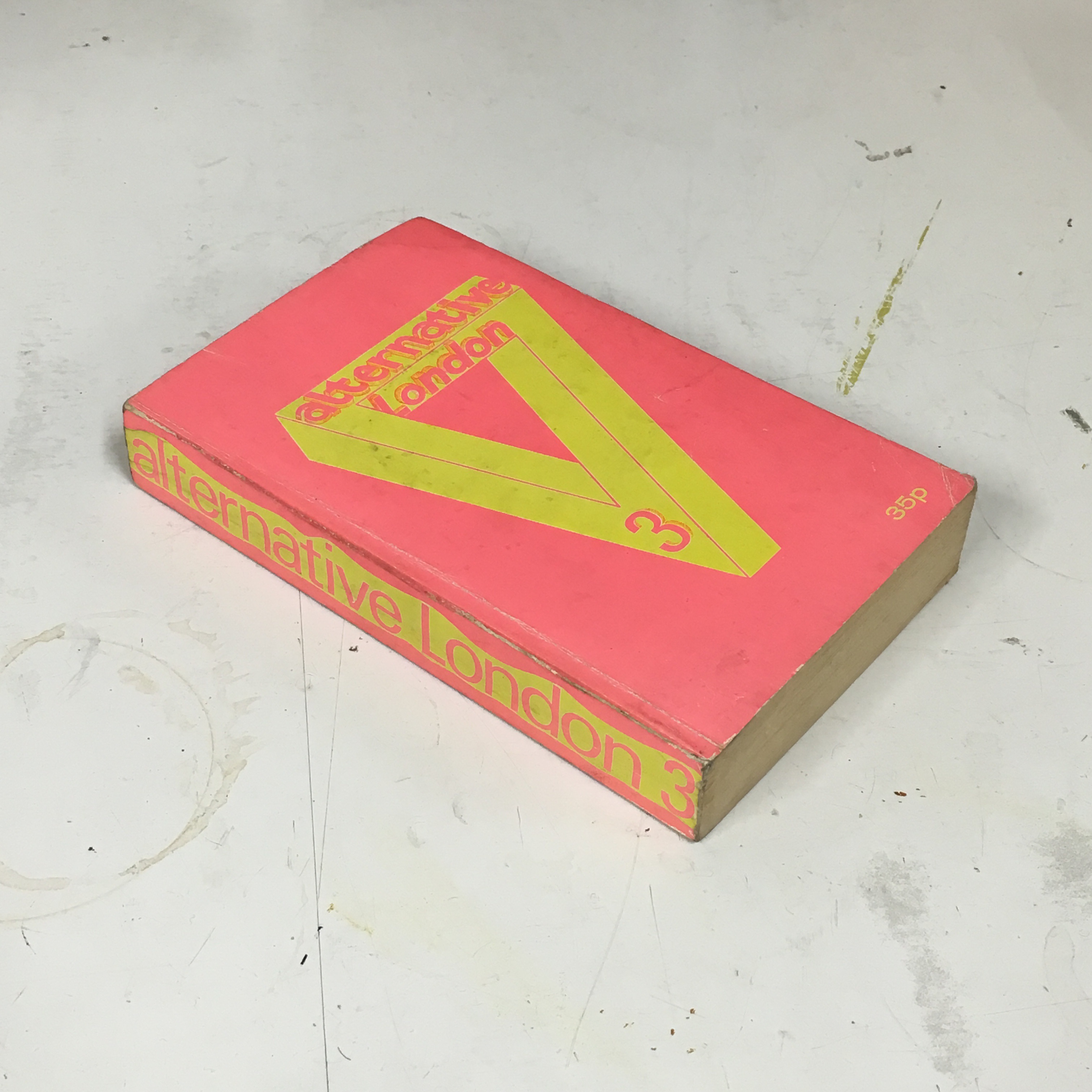 Photo of the third edition of “Alternative London” by Nicholas Saunders, a paperback with a pink and yellow cover