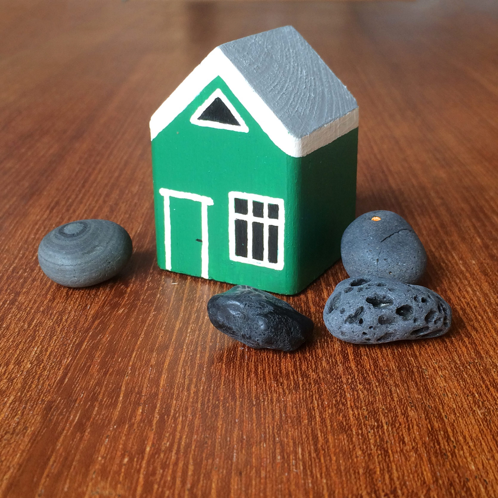 Green wooden toy house from a flea market in southern Iceland