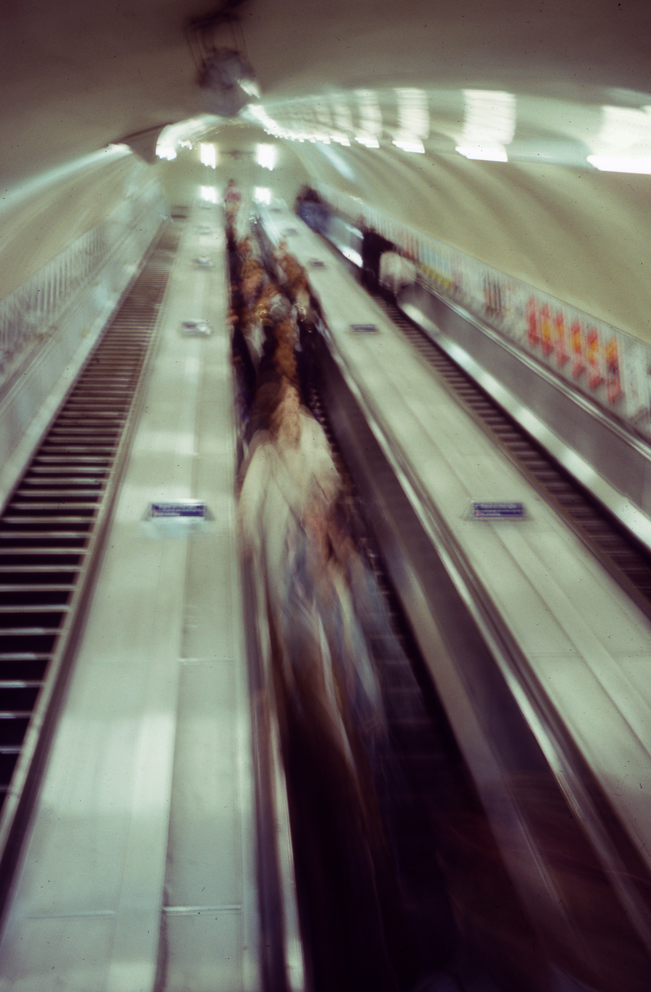 Blurry photograph of an escalator in a London underground station