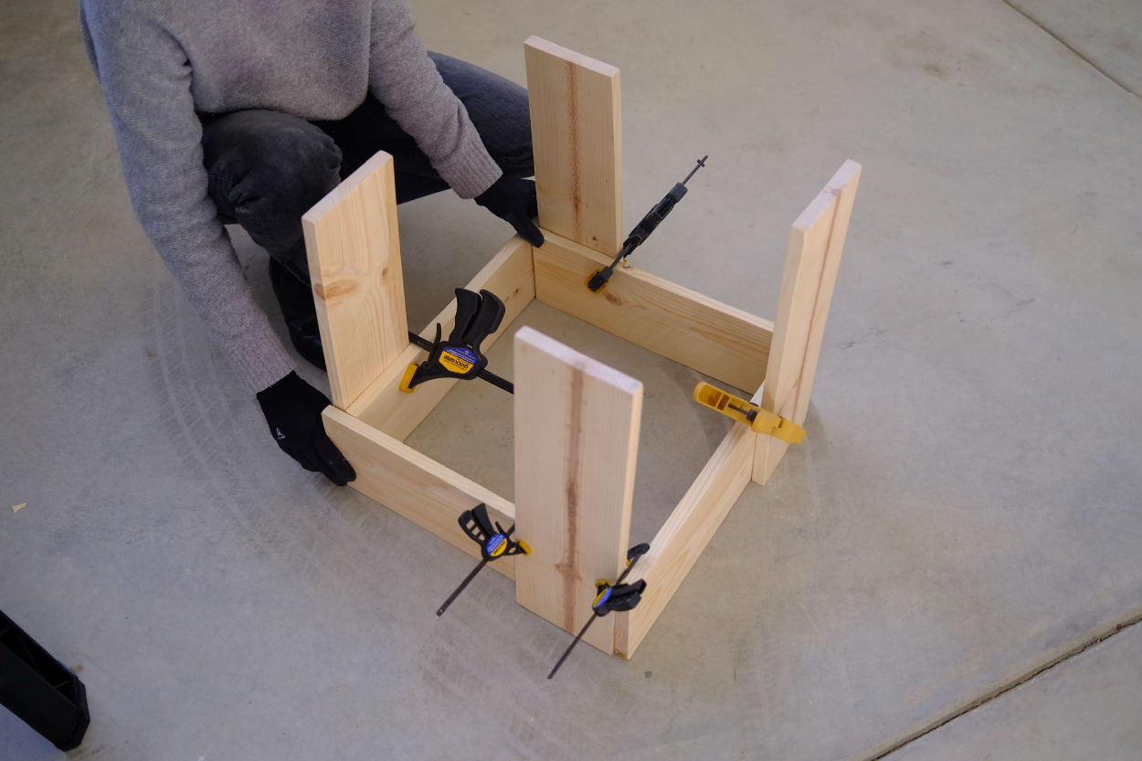 The clamped base of a Rietveld crate stool