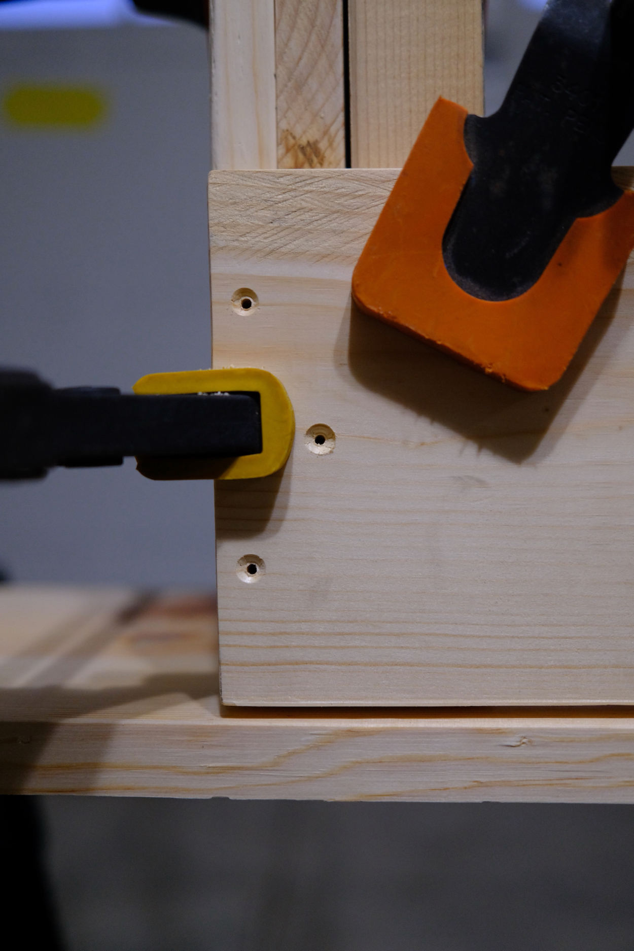 Pilot holes in the cross bar of a Rietveld crate stool