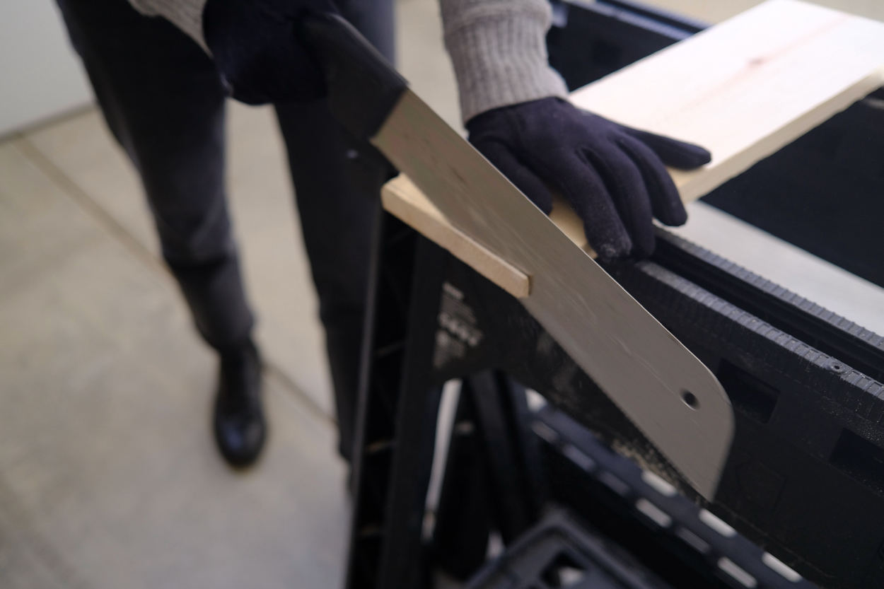 Sawing the end of a leg for a Rietveld stool