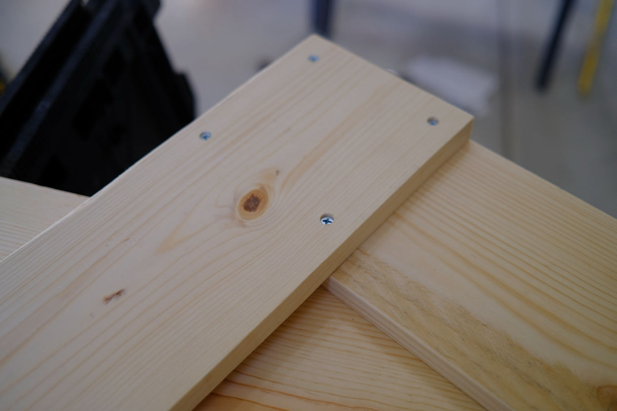 The leg and crossbar of a Rietveld crate stool