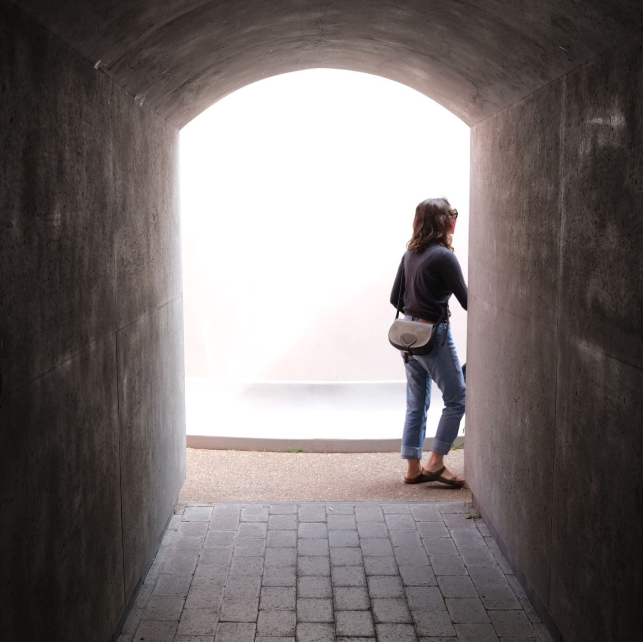 A woman walking in to James Turrell’s “Three Gems”
