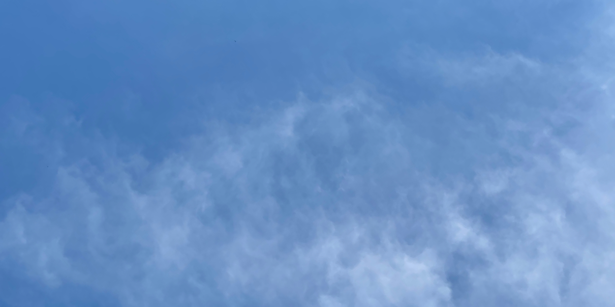 Wispy clouds against a blue sky